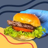 GRUB Singapore beef cheeseburger slider on a brioche bun with lettuce, tomato, and cheese.