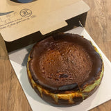 GRUB Singapore whole burnt cheesecake with creamy center and caramelized top, half basque and half kaya flavors.