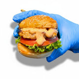 GRUB Singapore blue gloved hand holding a chicken burger slider with lettuce, tomato, and sauce