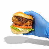 GRUB Singapore Crispy Portobello Mushroom Slider with lettuce, tomato, caramelized onions, and mayo on a brioche bun.