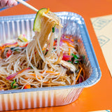 GRUB Singapore Korean Japchae vegan noodle tray with vegetables and mushrooms, served in foil container.
