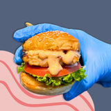 GRUB Singapore Mentaiko Grilled Chicken Slider with sesame seed bun, lettuce, tomato, and mentaiko mayo.