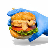 GRUB Singapore Mentaiko Grilled Chicken Slider with sesame seed bun, lettuce, tomato, and mentaiko mayo.