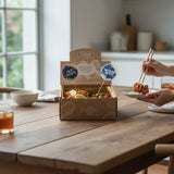 GRUB Singapore Mixed Bites Box with 25 Crispy Fish Bites and 25 Har Cheong Gai Chicken Bites, garnished with lemon and lime slices.
