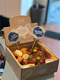 GRUB Singapore Mixed Bites Box with 25 Crispy Fish Bites and 25 Har Cheong Gai Chicken Bites, garnished with lemon and lime slices.