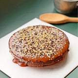 GRUB Singapore Salted Caramel Chocolate Tart with dark chocolate ganache, salted caramel, and hazelnut praline topping.