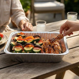 GRUB Singapore assorted yakitori tray with teriyaki chicken skewers and mixed vegetable skewers on a wooden table.